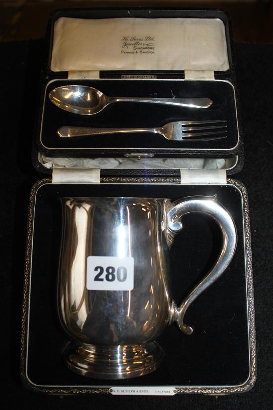 Cased silver mug and christening pair